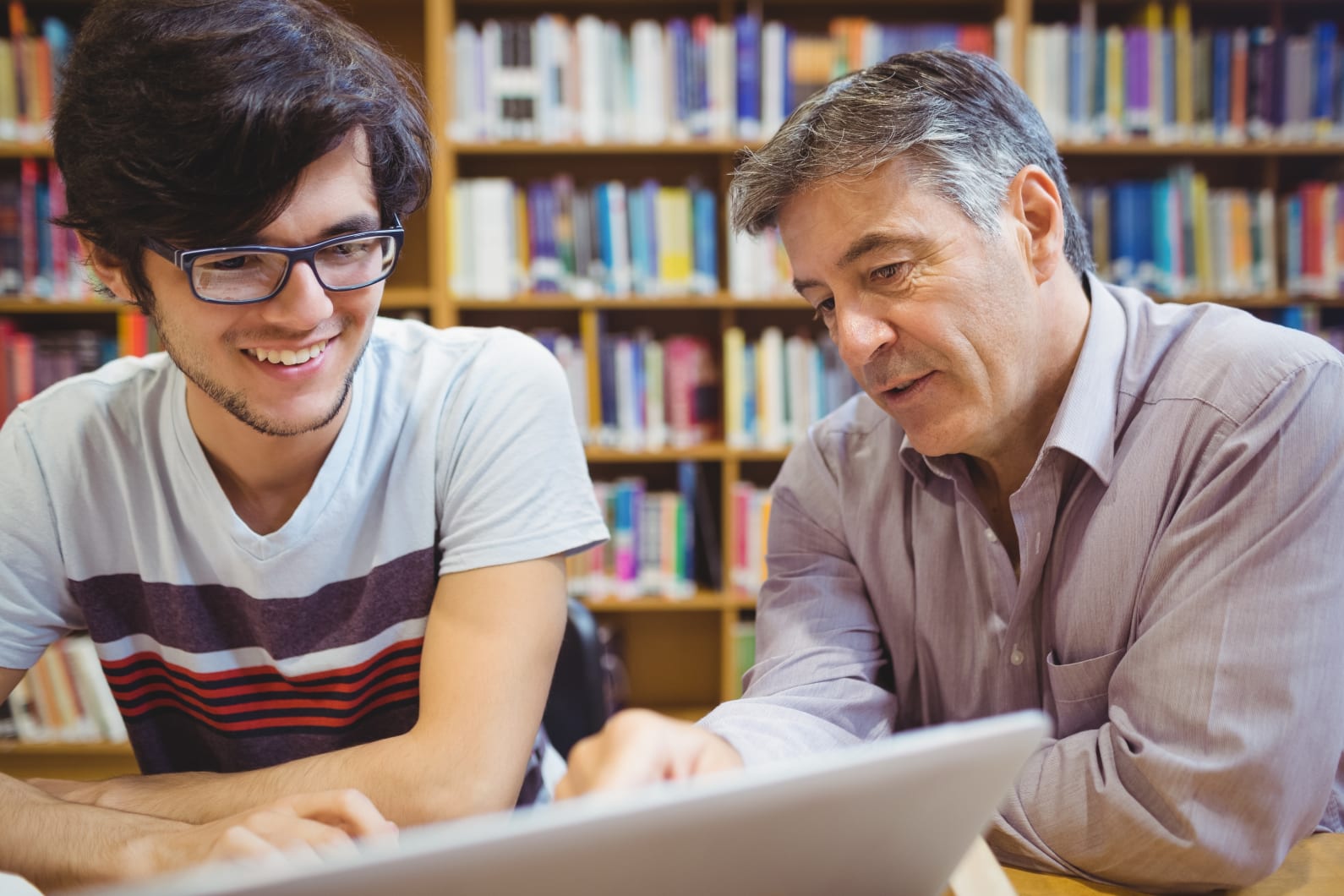 Student and instructor reviewing educational materials