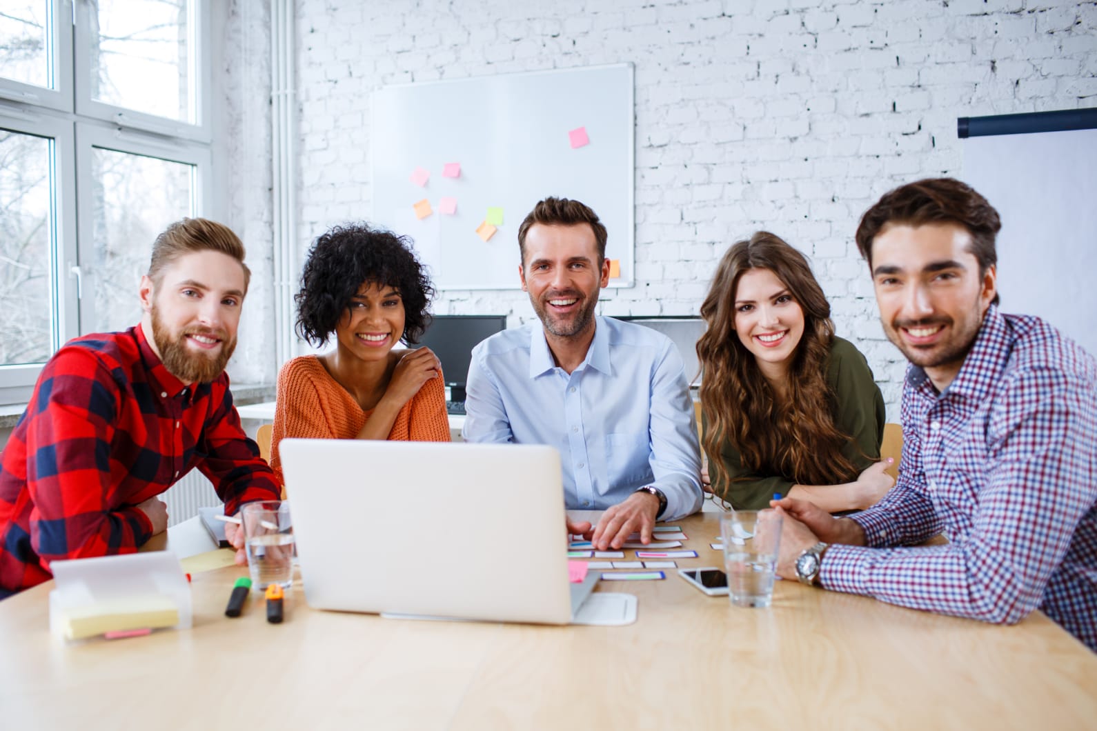 teachers in front of one computer