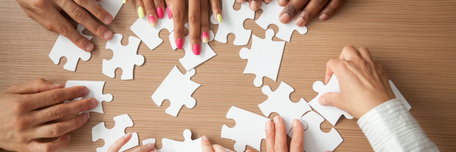 picture of people putting a puzzle together