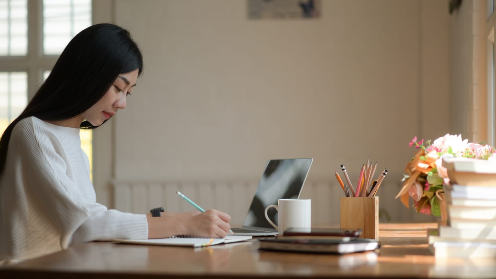 student at desk studying for exams