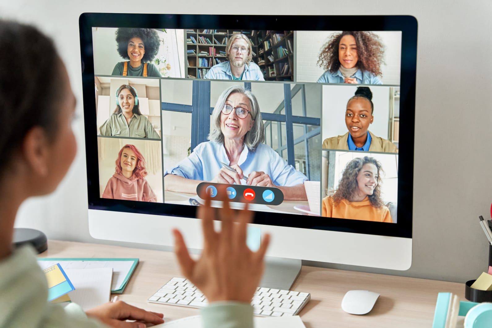 Instructor talking to fellow team members on zoom (on a computer screen)