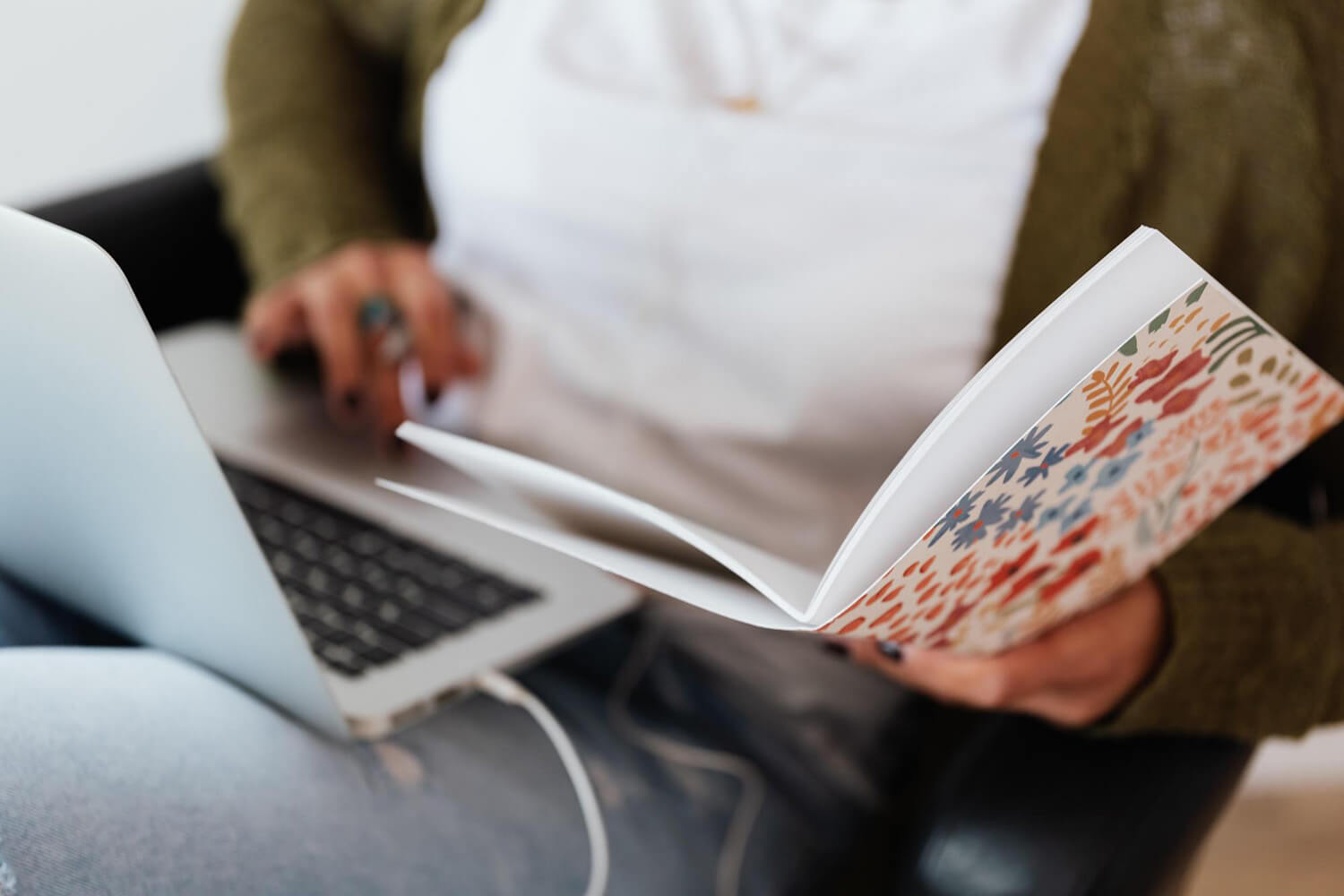 Student studying with a laptop and notebook