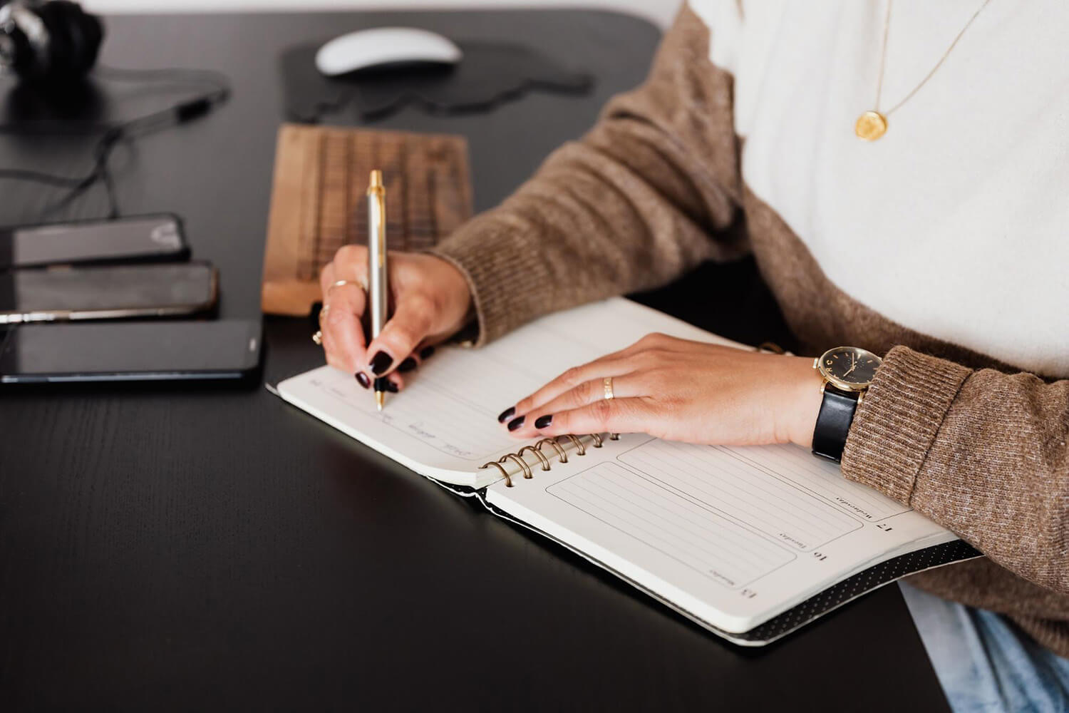 Teacher writing in a notebook