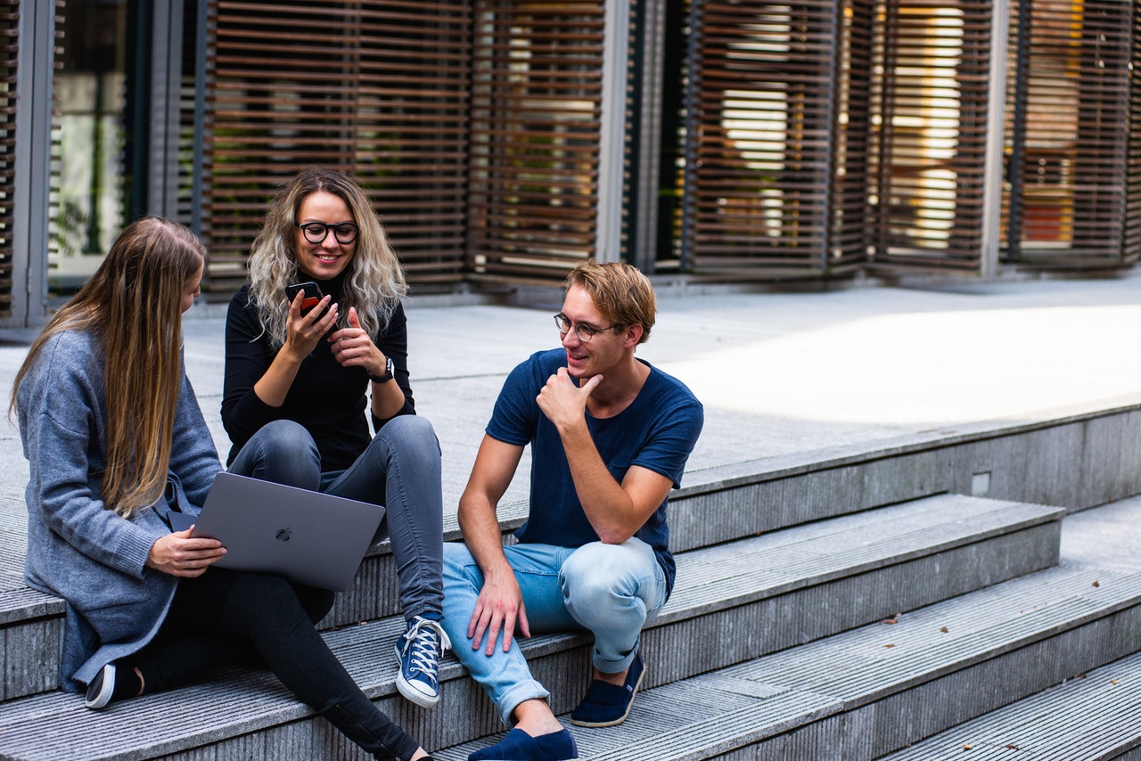 A group of students working together at a computer