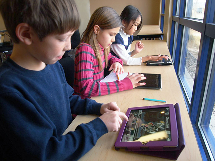 kids working on a tablet