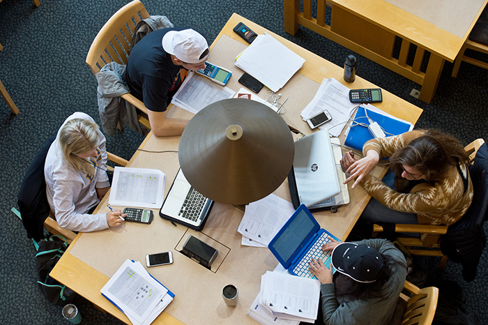 group of students at a desk using Crowdmark software