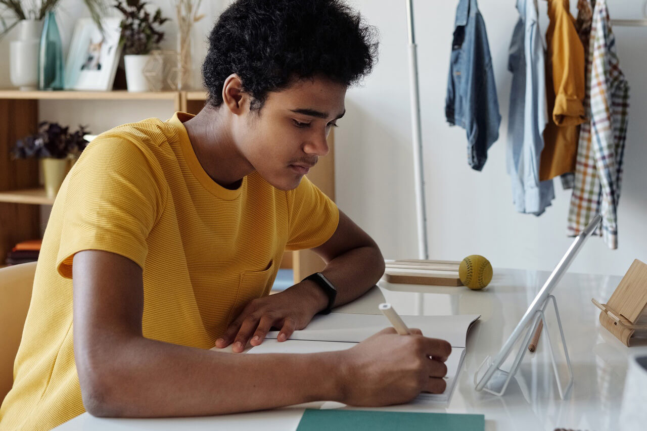 Student completing work on a laptop