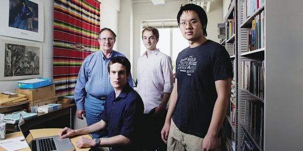 Students and instructor standing in study space.