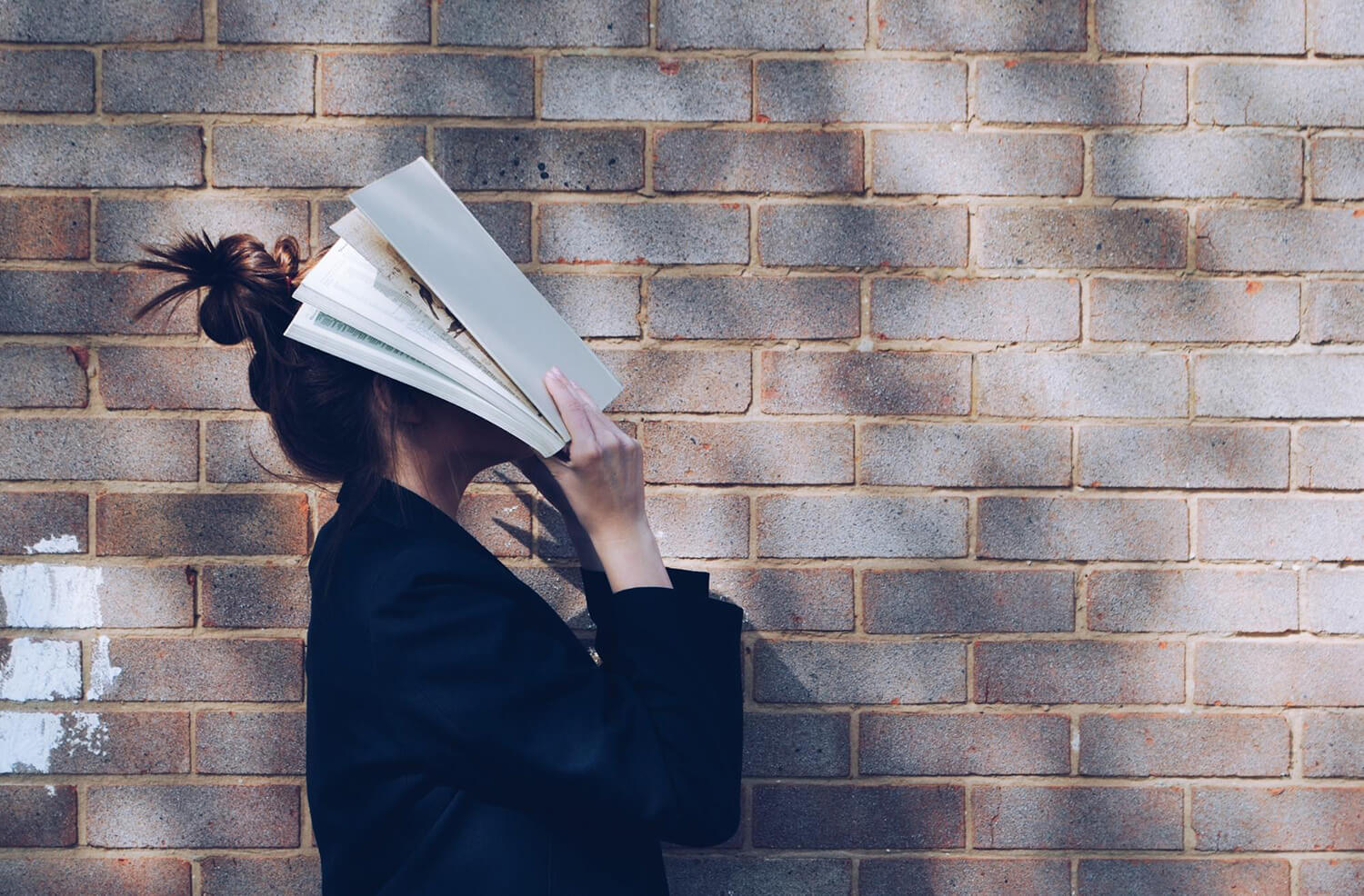 Student with their face in a book