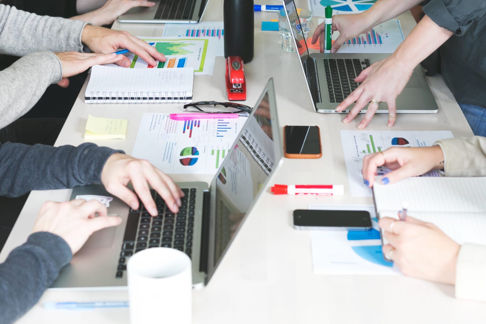 people looking at computers with big data