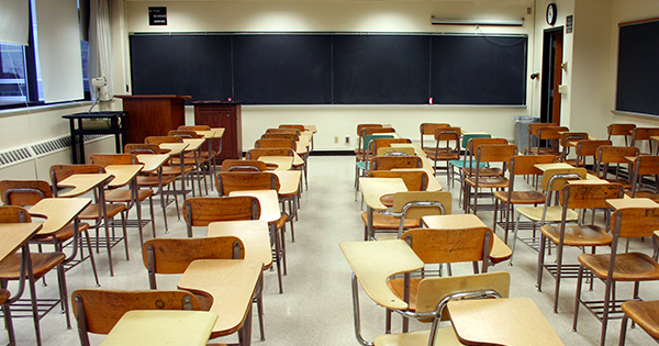 Empty classroom with chairs and desks.